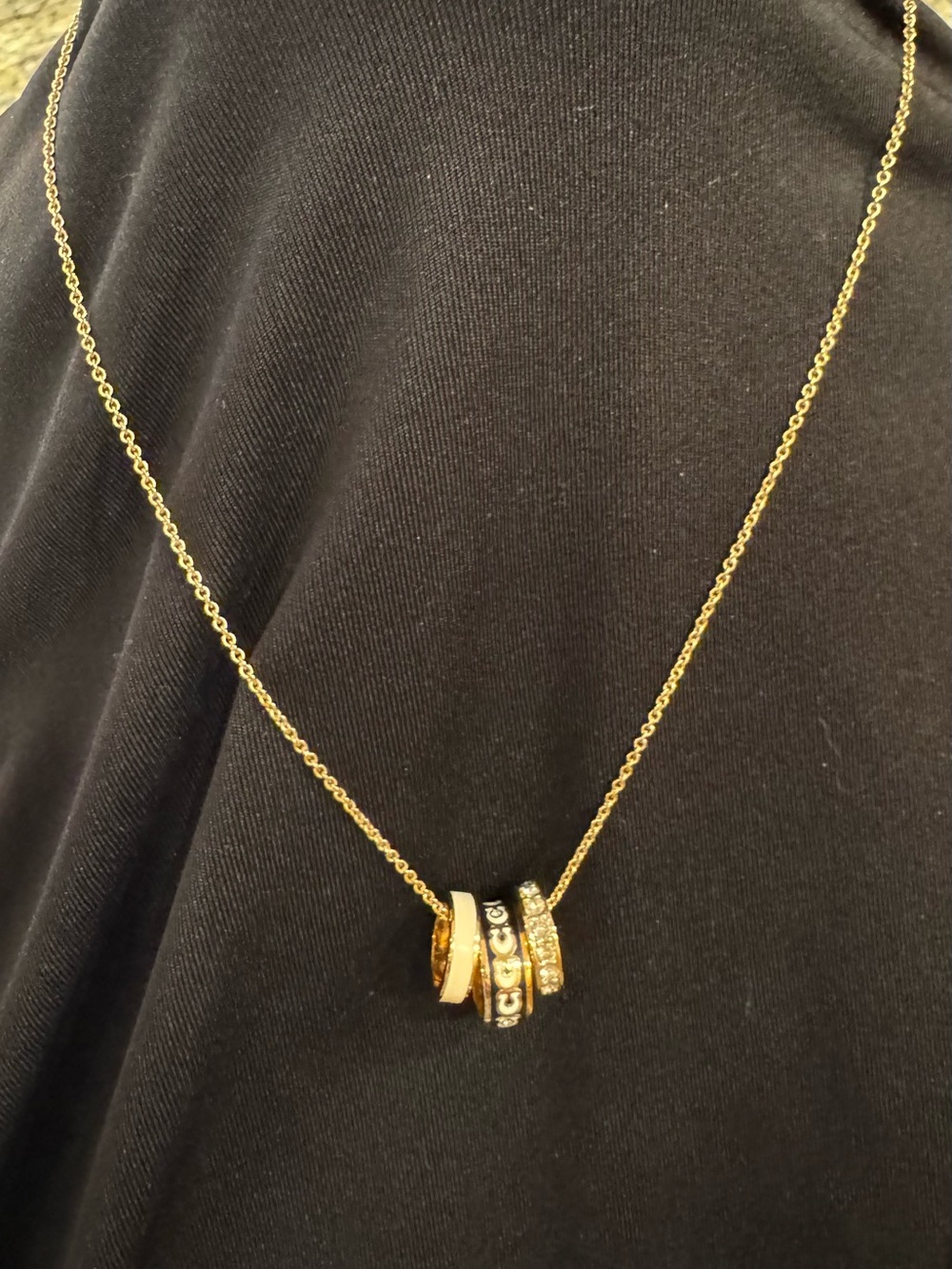 Coach Gold-Tone Multi-Ring Pendant Necklace with Black Accents